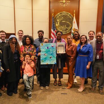 Black History Month Proclamation - group of community members and Council standing in front of the dais