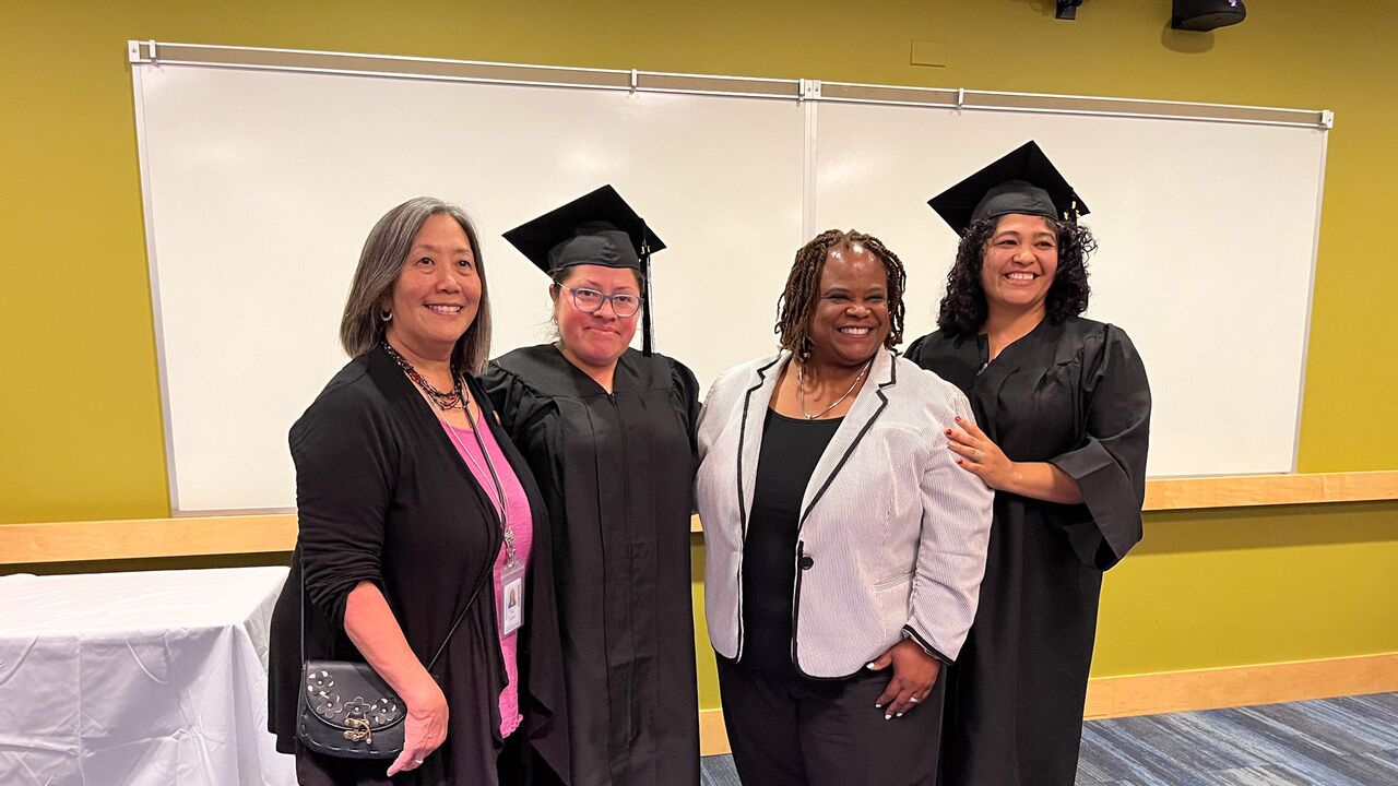 Graduates Iris Cruz and Lorena Villalta with Librarian Barbara Fleeman and Valerie Hardie, Strategic Ambassador for Smart Horizons Online Education 