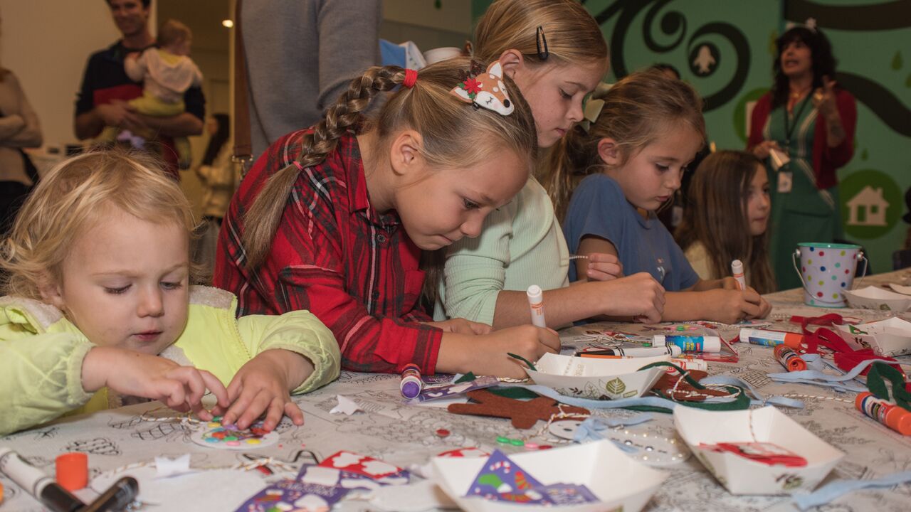 children making holiday crafts in the Main Library Youth Activity Room