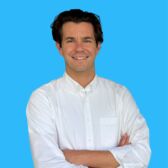 2026 School Board Candidate Headshot Robbie Staenberg with blue background