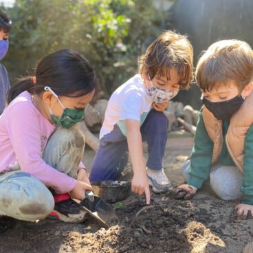 Children playing in mud at Growing Place