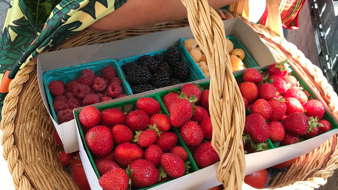 farm basket of berries at the farmers market