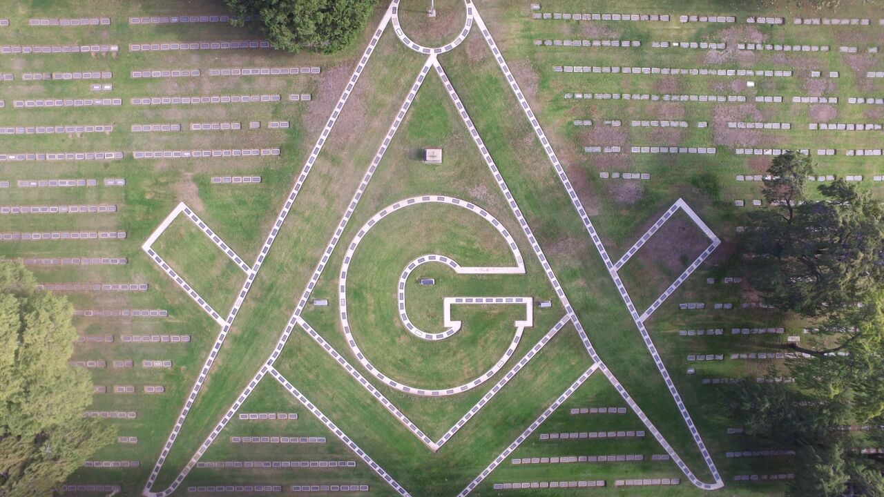 Arial view of the Masons' civic organization Stone in Compass symbol made by graves at Woodlawn Cemetery