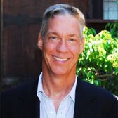 Election 2018 School Board Candidate Foster with trees and dark building in background