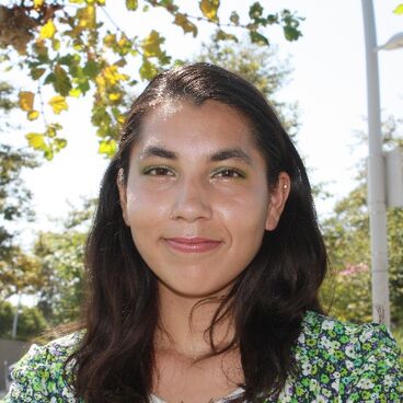 2022 Council Candidate Samantha Mota with trees in background