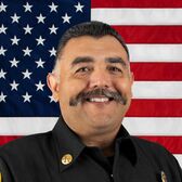 Portrait of Battalion Chief James Altman with United States Flag in the Background