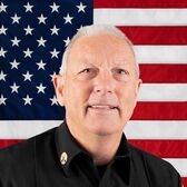 Portrait of Battalion Chief Jeff Connor with United States Flag in the Background