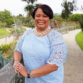 Nikima Newsome Wearing a Blue Dress Standing in Tongva Park