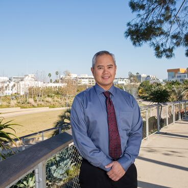 Acting Public Works Director Rick Valte Wearing a Blue Shirt and Red Tie in Tongva Park