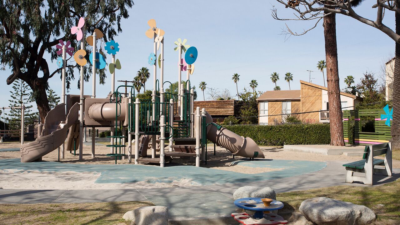 Joslyn Park Playground With Colorful Shapes Adorning the Top and Sand Surrounding the Play Area