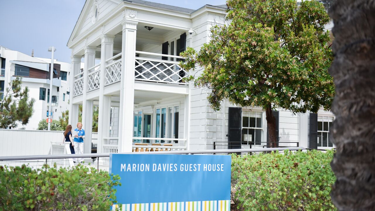 Marion Davies Guest House Sign with the Guest House in the Background