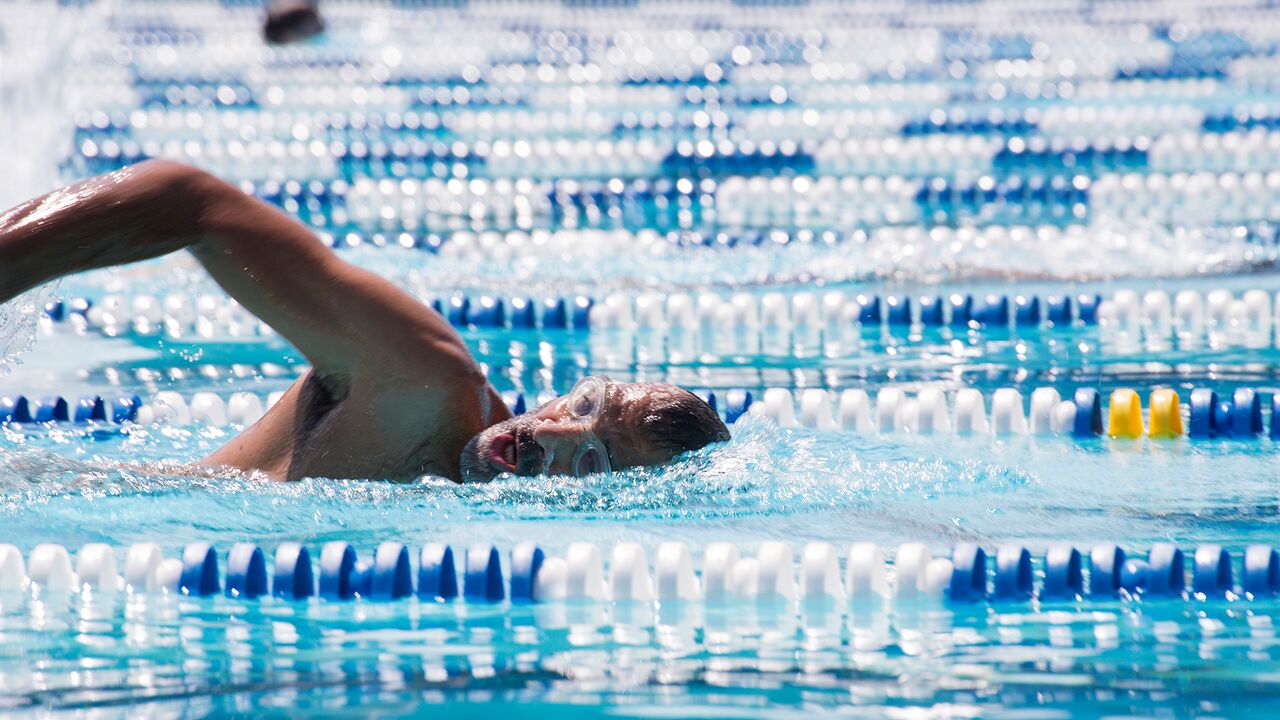 Swimmer using front crawl style during swim at the Swim Center