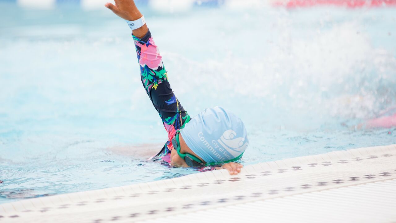 Youth practicing stroke during swim lesson at Santa Monica Swim Center