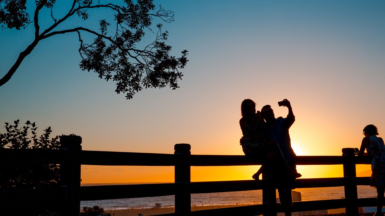 Couple Taking a Selfie During Sunset at Palisades Park