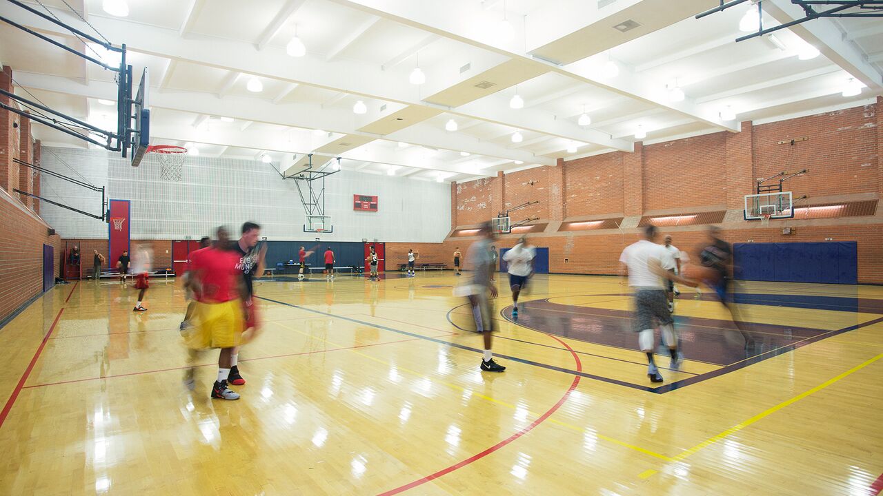 People playing basketball at Memorial Park Gym