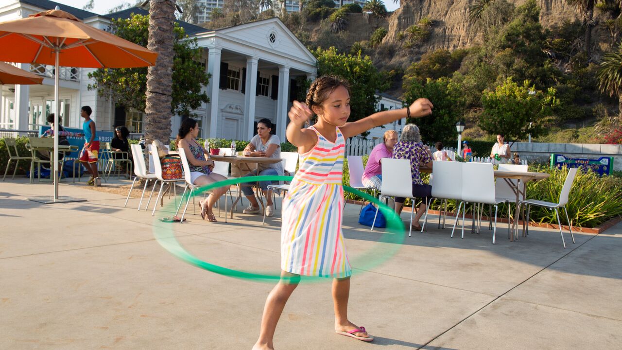 Young Girl Hula Hooping in Front of the Marion Davies Guest House