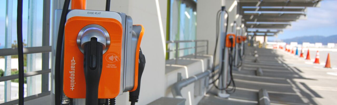 https://cityofsantamonica.getbynder.com/m/57c5ce3f6cadb09f/Desktop_Header-Orange-EV-Chargers-on-the-Roof-of-the-Civic-Parking-Structure-With-Solar-Panels-Above-and-Colored-Cones-on-the-Ground.jpg