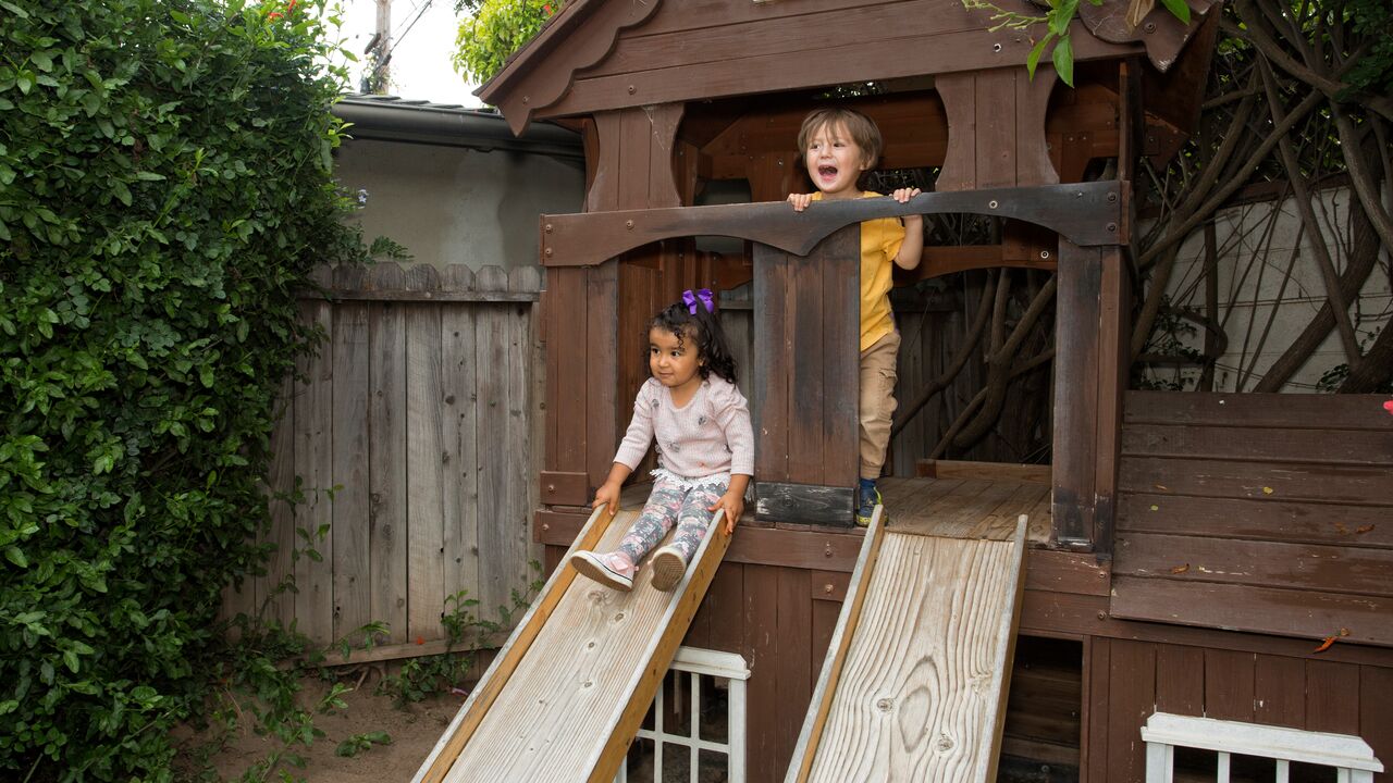 Two Children Playing on a Slide at Stepping Stone Preschool