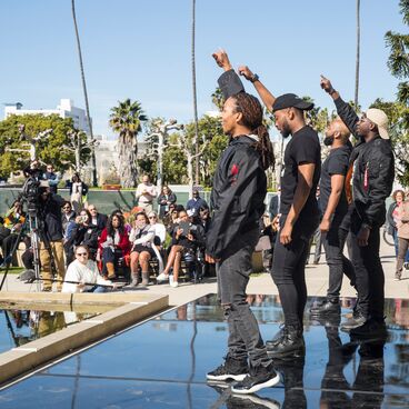 Alpha Phi Alpha Fraternity Performs at City Hall for Black History Month