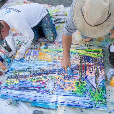 Two Artists Painting Image of the Santa Monica Pier at COAST