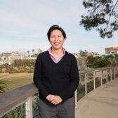 Planning Manager Jing Yeo Wearing a Black Sweater and Pink Shirt in Tongva Park