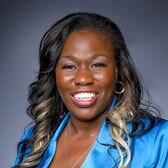 2024 Council Candidate Ericka Lesley headshot with dark blue background