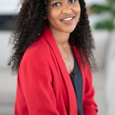 Election 2020 Rent Control Candidate Aisha Newson with plant and white and black background