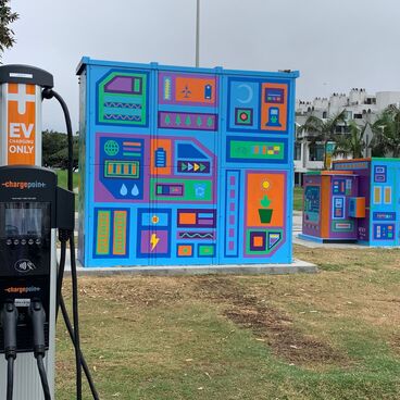 Electric Vehicle Charger with Painted Utility Boxes 